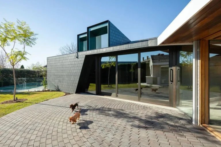 Modern house with patio and garden area.