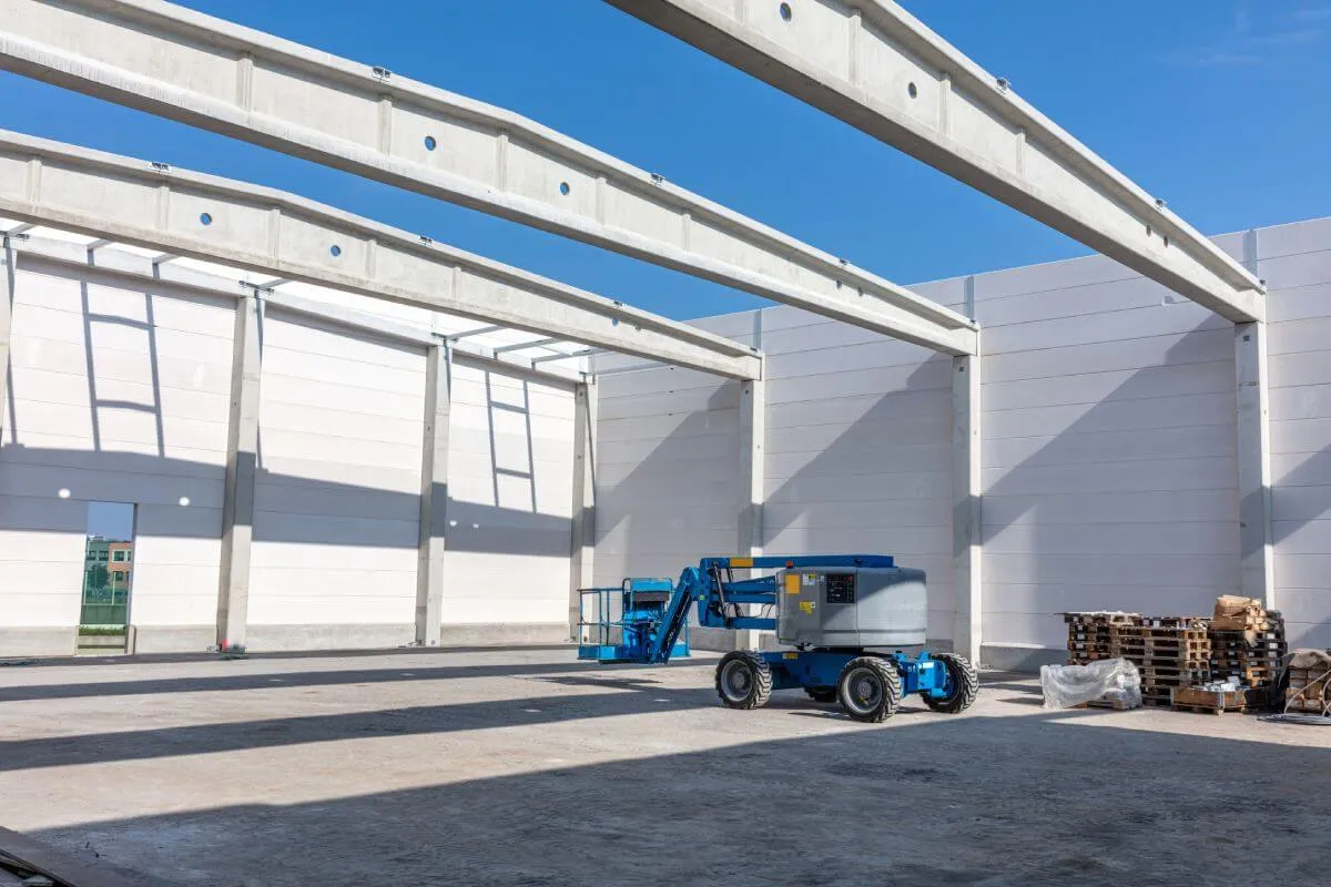 Construction site with a blue aerial lift