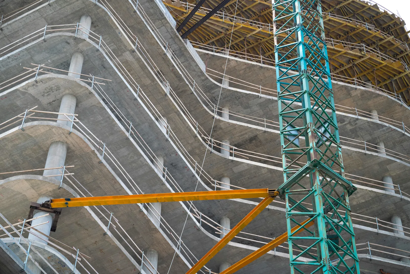 Construction site with crane and unfinished building
